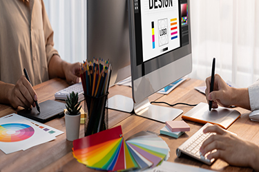 graphic designer works on computer laptop with digital pen. scrutinize